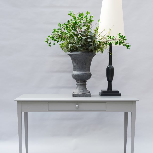 Tapered leg console